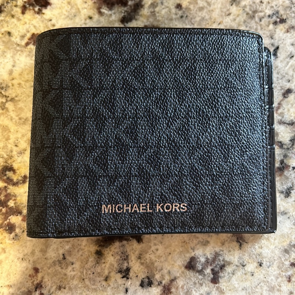 Brand new Michael Kors men’s wallet with tag.